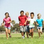 Group Of Children Running In Park Group Of Children Running In Park